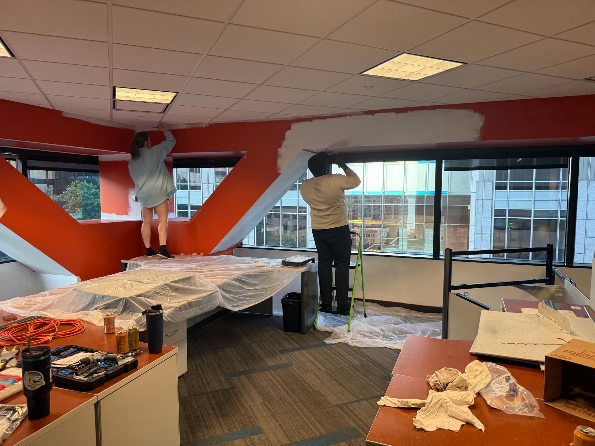 Painting over the old orange beams, ladders and drop cloths everywhere
