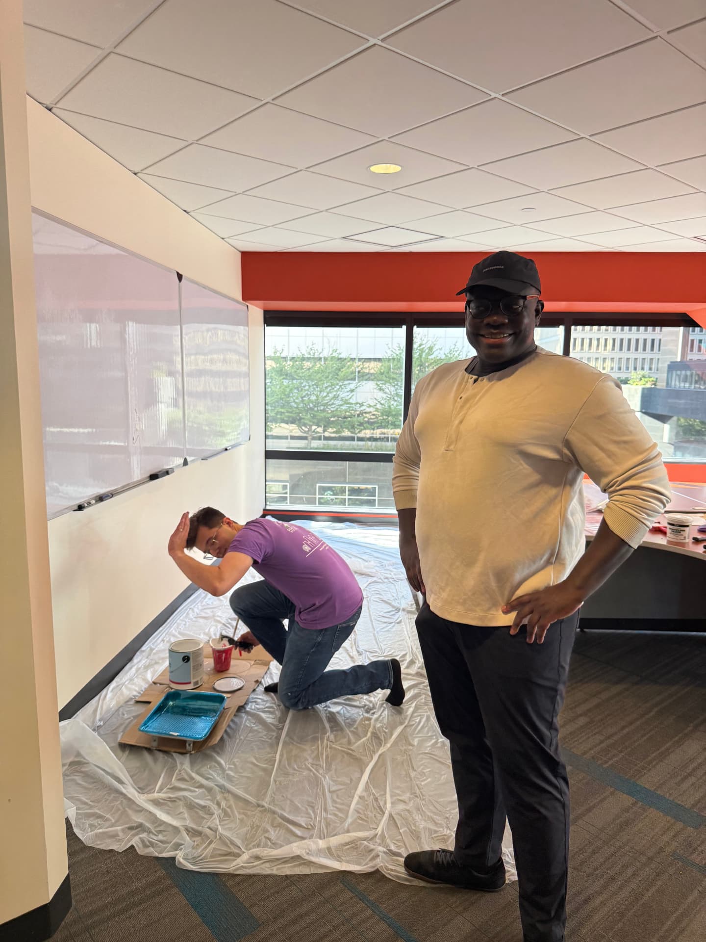 Volunteers priming the walls on move-in day