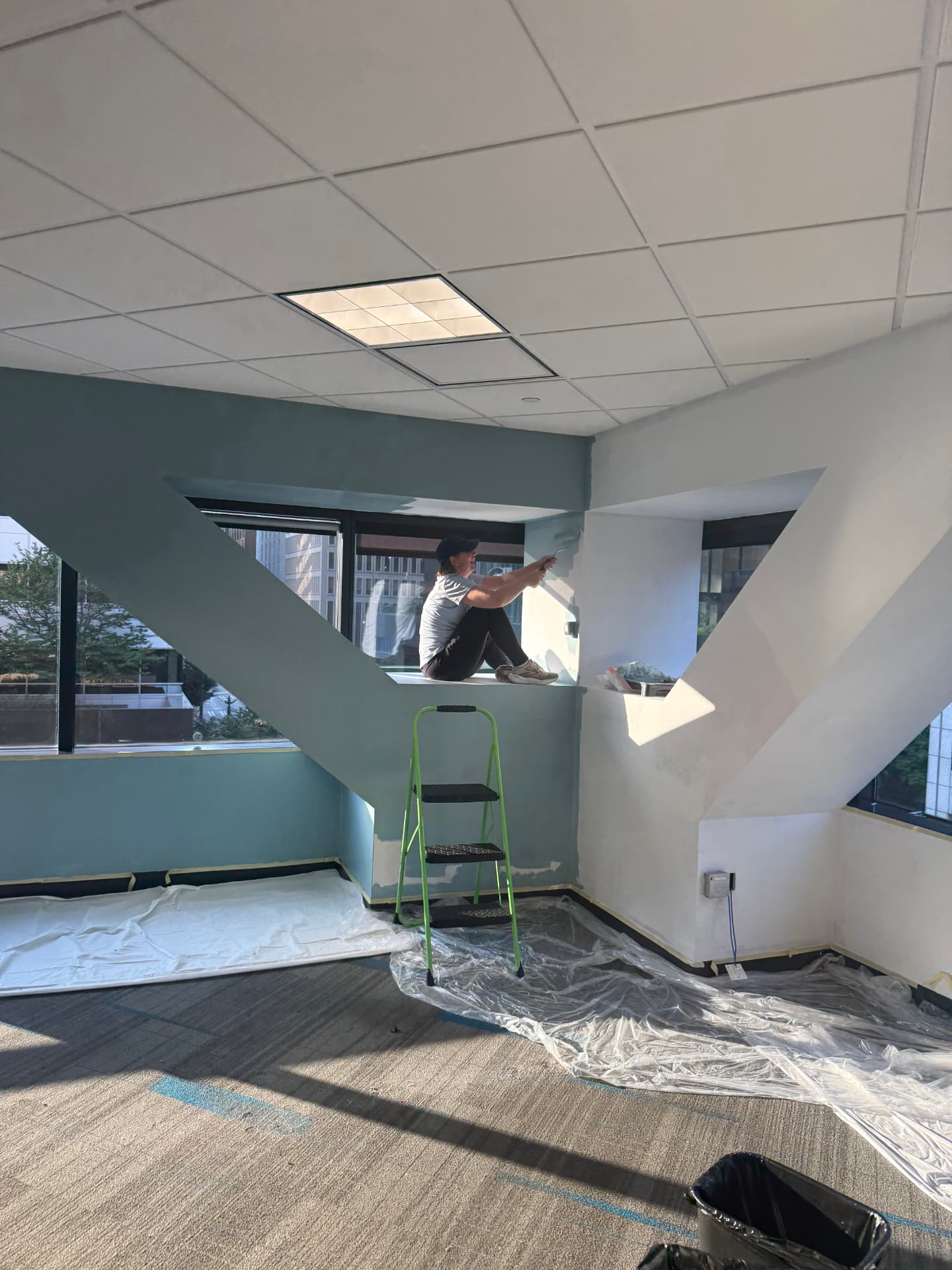 Cutting in the fresh teal on the beams by the window